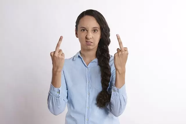 woman with two middle fingers raised