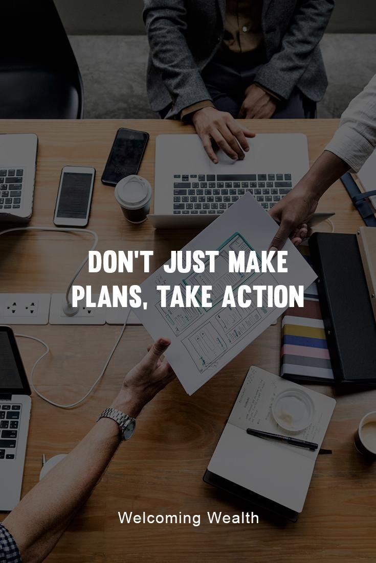 don't just make plans, take action. Business desk with people hading papers to each other.